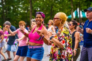Ladies dancing to great music at a summer concert